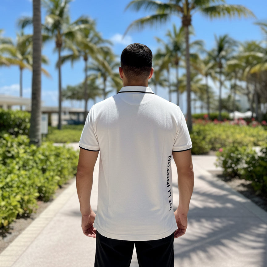 man wearing white rolex series equestrian polo back