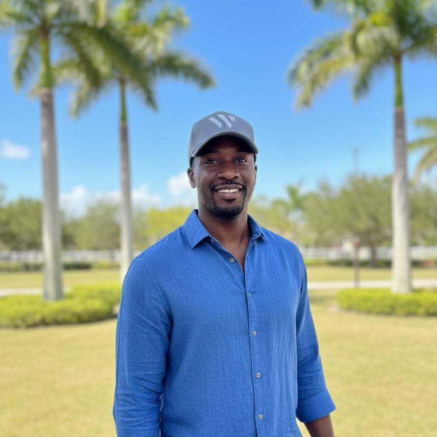 man wearing grey wellington international hat outsdoors