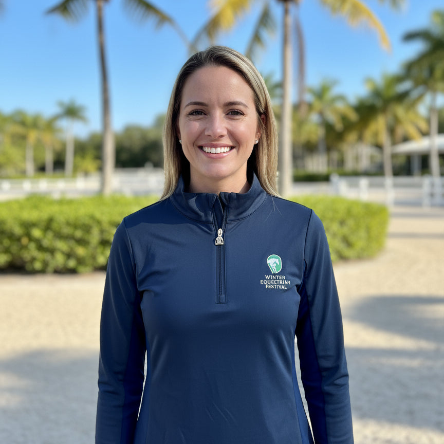 woman wearing the navy wef sunshirt outside