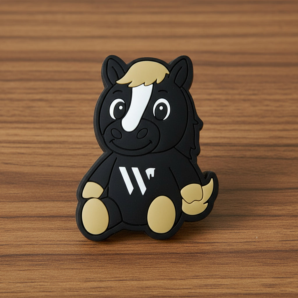 Black and brown horse mascot with a white stripe on a wooden background